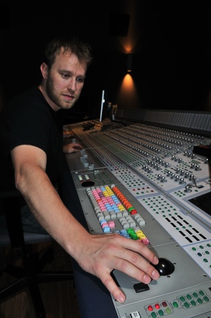 mixer working with the mixing console in sound studioの写真素材