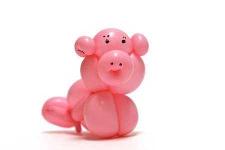 pink balloon piggy isolated on white backgroundの写真素材
