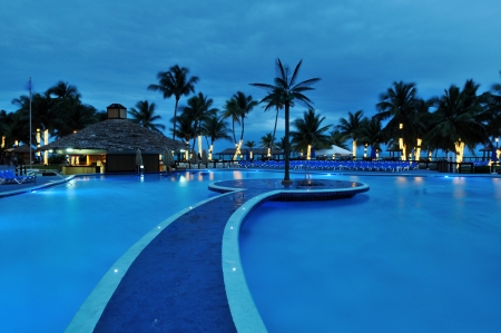 Swimming Pool and palm trees in a resort in Bahamasのeditorial素材