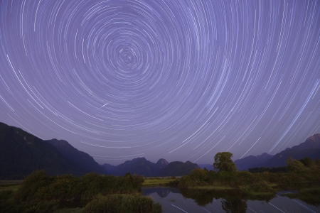 Startrails and meteor fire ball near Pitt River and Golden Ears Mountain