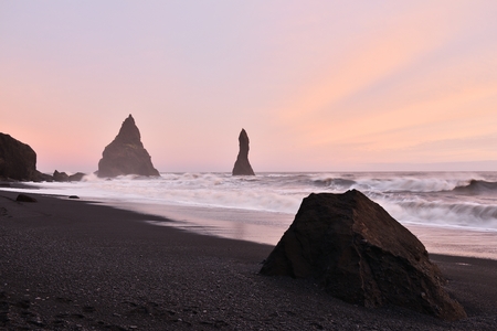 Sunset at Reynisfjara black sand beach in southern Icelandの写真素材