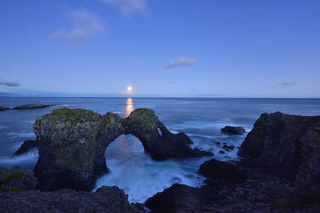 Gatklettur at autumn sunset, an  Arch Rock in west Icelandの写真素材