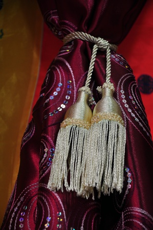 Thai silk curtain with beautiful curtain tassel の写真素材