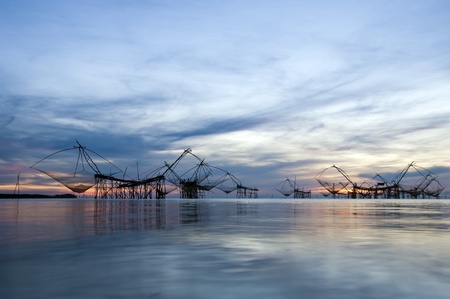 catching fish with fishnet on the  talanoiの写真素材