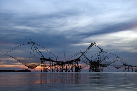 catching fish with fishnet on the  talanoiの写真素材