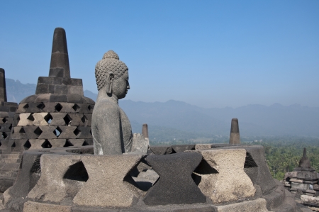 Buddha statue. Mountain on background. Borobudur. Java. Indonesiaの写真素材