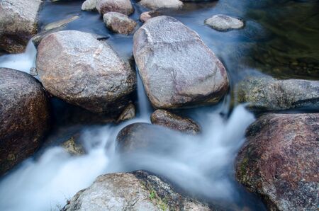 Nice small waterfall cascade on mountain river
