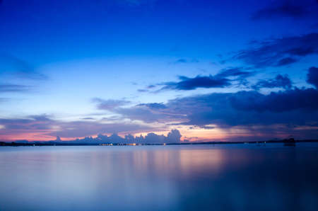 Purple sunset with cloud strom background day night Dramatic sunset sky Red purple cloud sunset sky. Songkhla. Thailandの写真素材