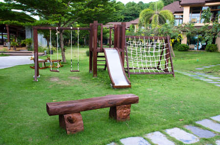 Playground structure, outdoor idea of school or public park with wood equipment for recreation, kid fun kit in schoolyard, city playpark architecture.children Stairs Slides equipment.の写真素材