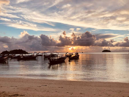 Beach sunrise of the sea with sky and cloud in twilight over light the sun, sunset and sunrise sea twilight. Thailandの写真素材
