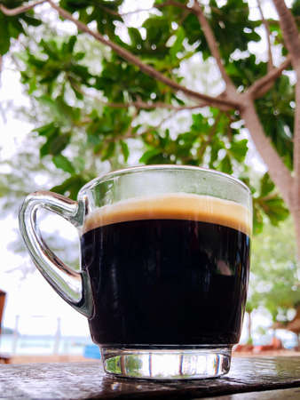 Coffee cup top old wooden on beach.の写真素材