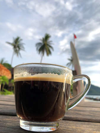 Coffee cup top old wooden on beach.の写真素材