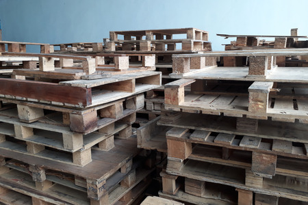 stacks of old wood palletsの写真素材