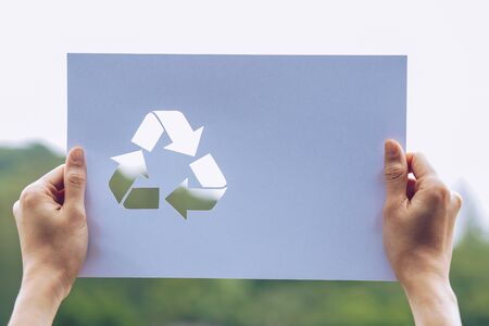 Save world ecology concept environmental conservation with hands holding cut out paper recycle...