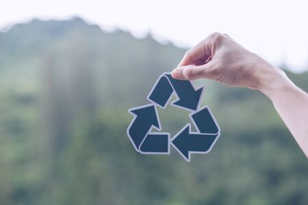 Save world ecology concept environmental conservation with hands holding cut out paper recycle showingの写真素材