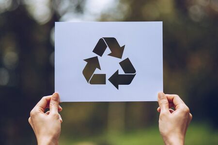 Save world ecology concept environmental conservation with hands holding cut out paper recycle showingの写真素材