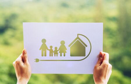Save world ecology concept environmental conservation with hands holding cut out paper earth loving ecology family showingの写真素材