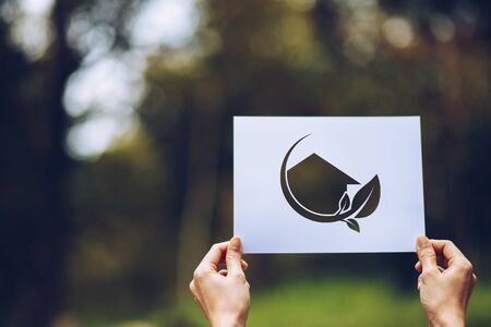 save world ecology concept environmental conservation with hands holding cut out paper showingの写真素材