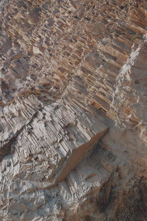 Texture, background and cracks of limestone rock interspersed with minerals.の写真素材