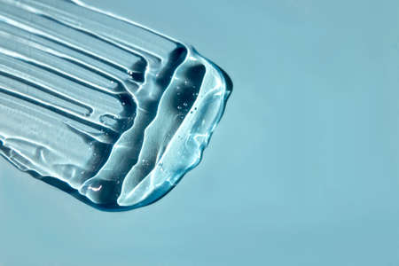 Hyaluronic acid gel with oxygen bubbles on a blue background.の写真素材