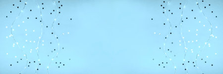 Banner with glowing garlands and sparkles in the form of stars. Place for text.の写真素材