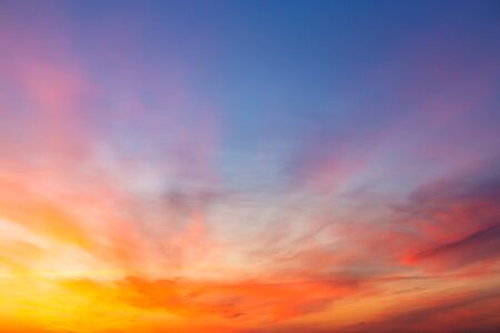 Colorful spectacular sunset sky with solar gradient in incredible colorsの写真素材