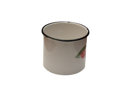 Old enamel metal mug on a white background. Ornamental cherry. December 1970.の写真素材