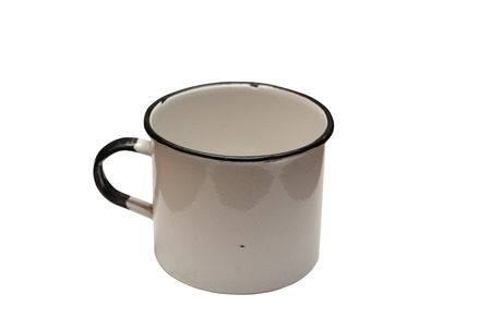 Old enamel metal mug on a white background.  December 1970.の写真素材