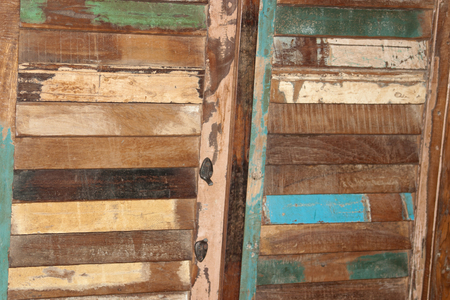 A fragment of the door of an old wardrobe with broken handlesの写真素材