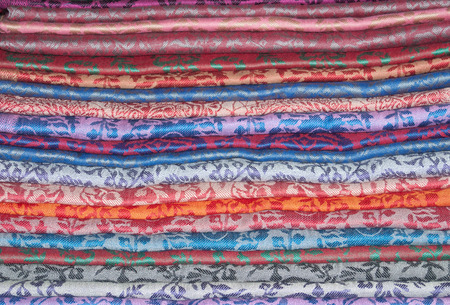 Background of eastern colorful cashmere stoles stackedの写真素材