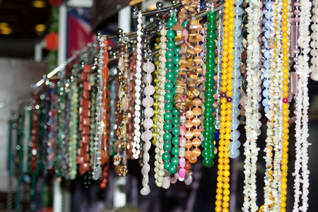 The counter with colorful beads and necklacesの写真素材