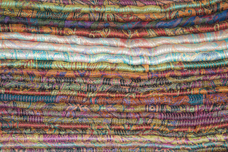 Background of Oriental cashmere stoles folded stackの写真素材