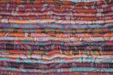 Background of Indian cashmere stoles folded stackの写真素材