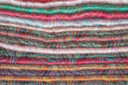 Background from the pile of Indian cashmere stolesの写真素材