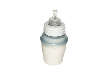 Plastic baby bottle with the milk mixture isolated on white background.の写真素材
