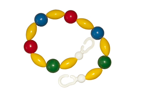 Baby rattle for pram isolated on a white background.の写真素材