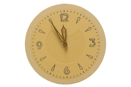 The clock face and hands at five to twelve on a white background.の写真素材