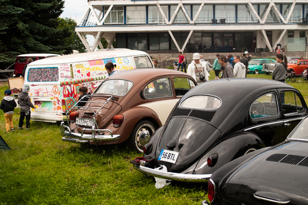 Saint Petersburg, Russia - July 08, 2017: Festival of old Volkswagen cars "Bughouse Fest 2017". The children paint an old van. Krestovsky island.のeditorial素材