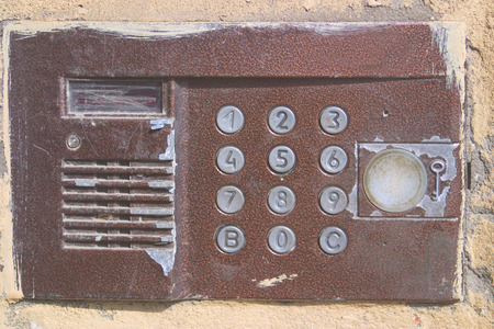 Old intercom in the entrance close-up.