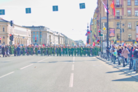 Blurred background image of a cordon of the soldiers during the procession of citizens.
