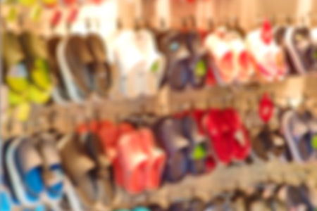 Blurred a counter with colorful shoes backgroundの写真素材