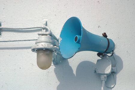 Old ship loudspeaker and lampの写真素材