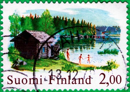 Saint Petersburg, Russia - February 01, 2020: Stamps issued in the Finland with the image of the Sauna And The Lake, circa 1977のeditorial素材