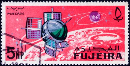 Saint Petersburg, Russia - February 06, 2020: Stamp issued in the Fujairah with the image of the Research satellite Explorer 6, USA. From the series on Exploration and Use of Outer Space, circa 1966のeditorial素材
