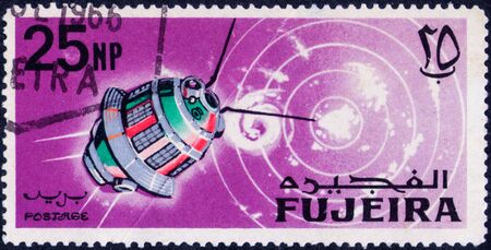 Saint Petersburg, Russia - February 06, 2020: Stamp issued in the Fujairah with the image of the Lunar probe Luna 3, USSR. From the series on Exploration and Use of Outer Space, circa 1966のeditorial素材