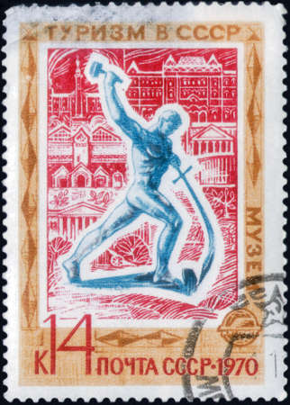Saint Petersburg, Russia - March 06, 2020: Stamp issued in the Soviet Union dedicated to the Tourism in USSR. Sculpture Swords into Ploughshares, circa 1970のeditorial素材