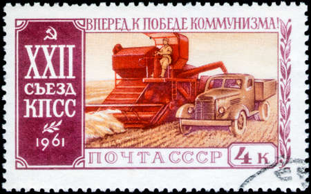 Saint Petersburg, Russia - March 15, 2020: Stamp issued in the Soviet Union with the image of the Combine-harvester and truck. From the series on 22nd Communist Party Congress, circa 1961のeditorial素材