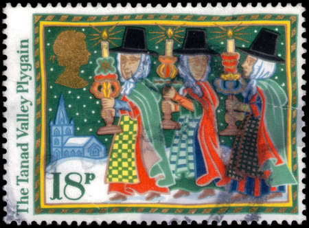 Saint Petersburg, Russia - March 21, 2020: Stamp issued in the United Kingdom with the image of The Tanad Valley Plygain. From the series on Christmas, Folk Customs, circa 1986のeditorial素材