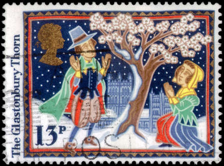 Saint Petersburg, Russia - March 21, 2020: Stamp issued in the United Kingdom with the image of The Glastonbury Thorn. From the series on Christmas, Folk Customs, circa 1986のeditorial素材