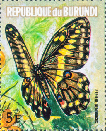 Saint Petersburg, Russia - March 15, 2020: Stamp issued in the Burundi with the image of the Papilio demodocus. From the series on Flowers and Butterflies, circa 1973のeditorial素材